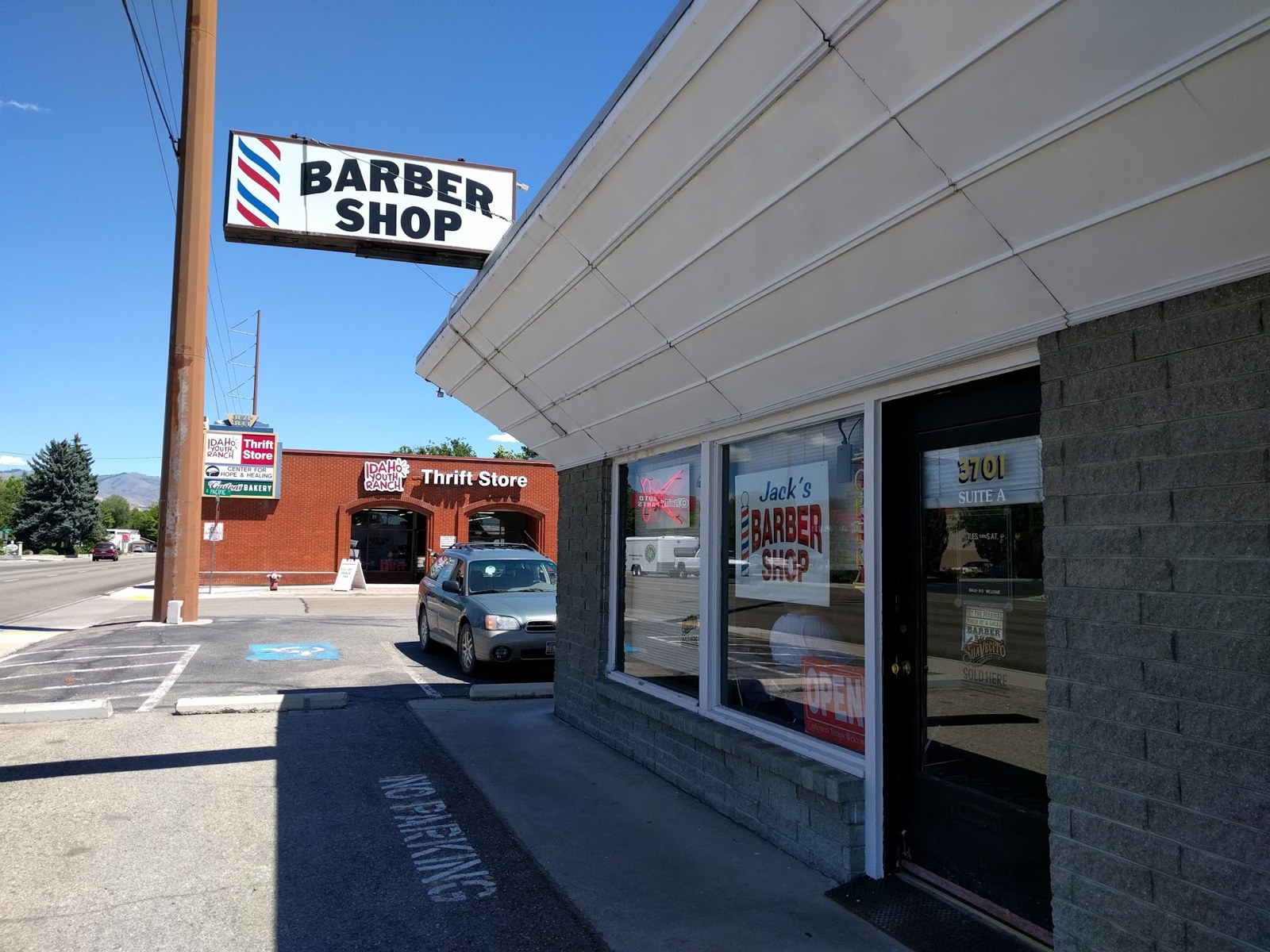 Iron Barber storefront and barber shop sign on Overland Road